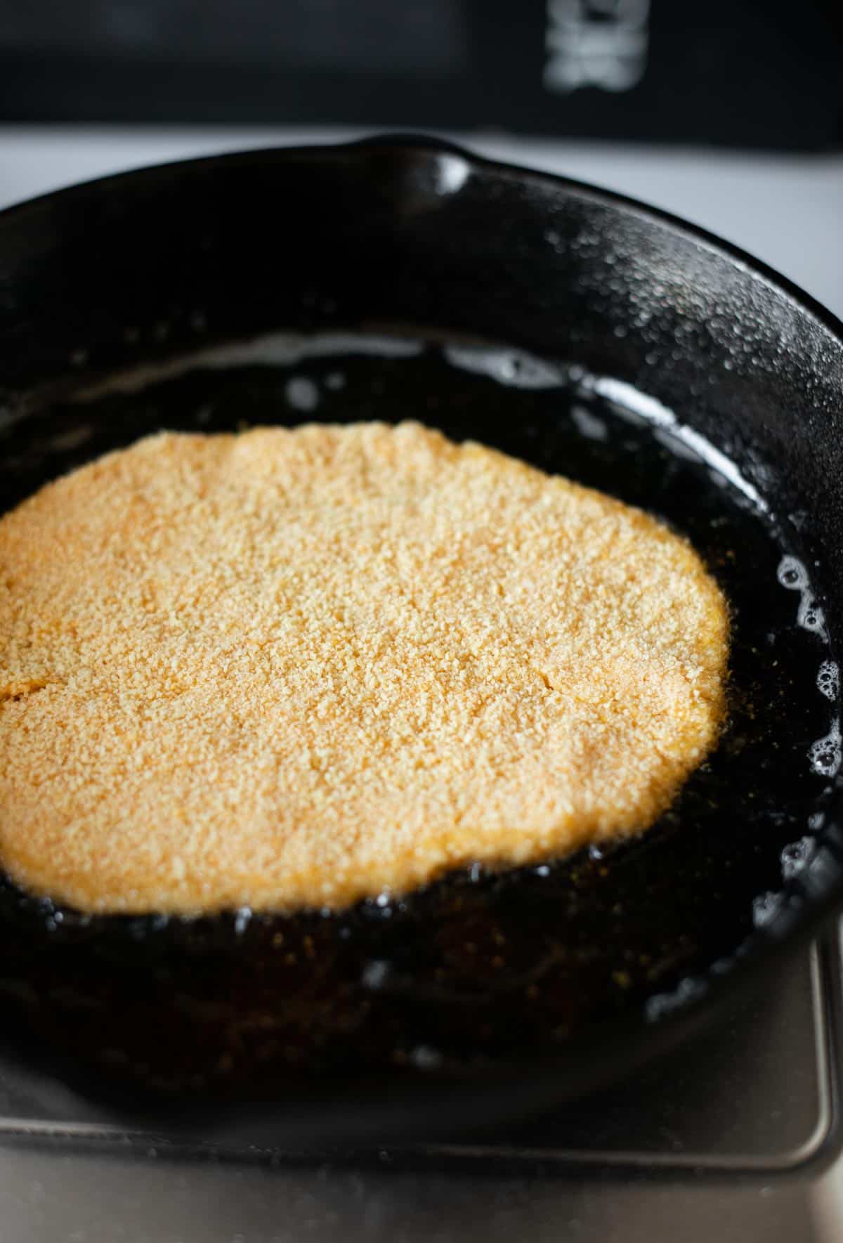 Image of the cutlet frying in a pan