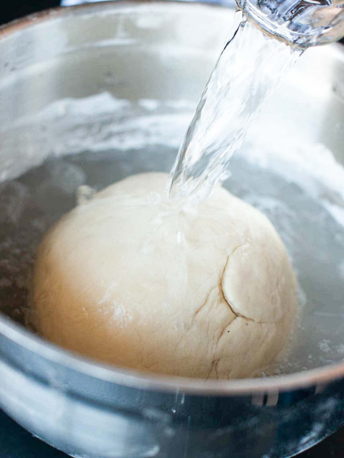 This image shows the dough covered in water.