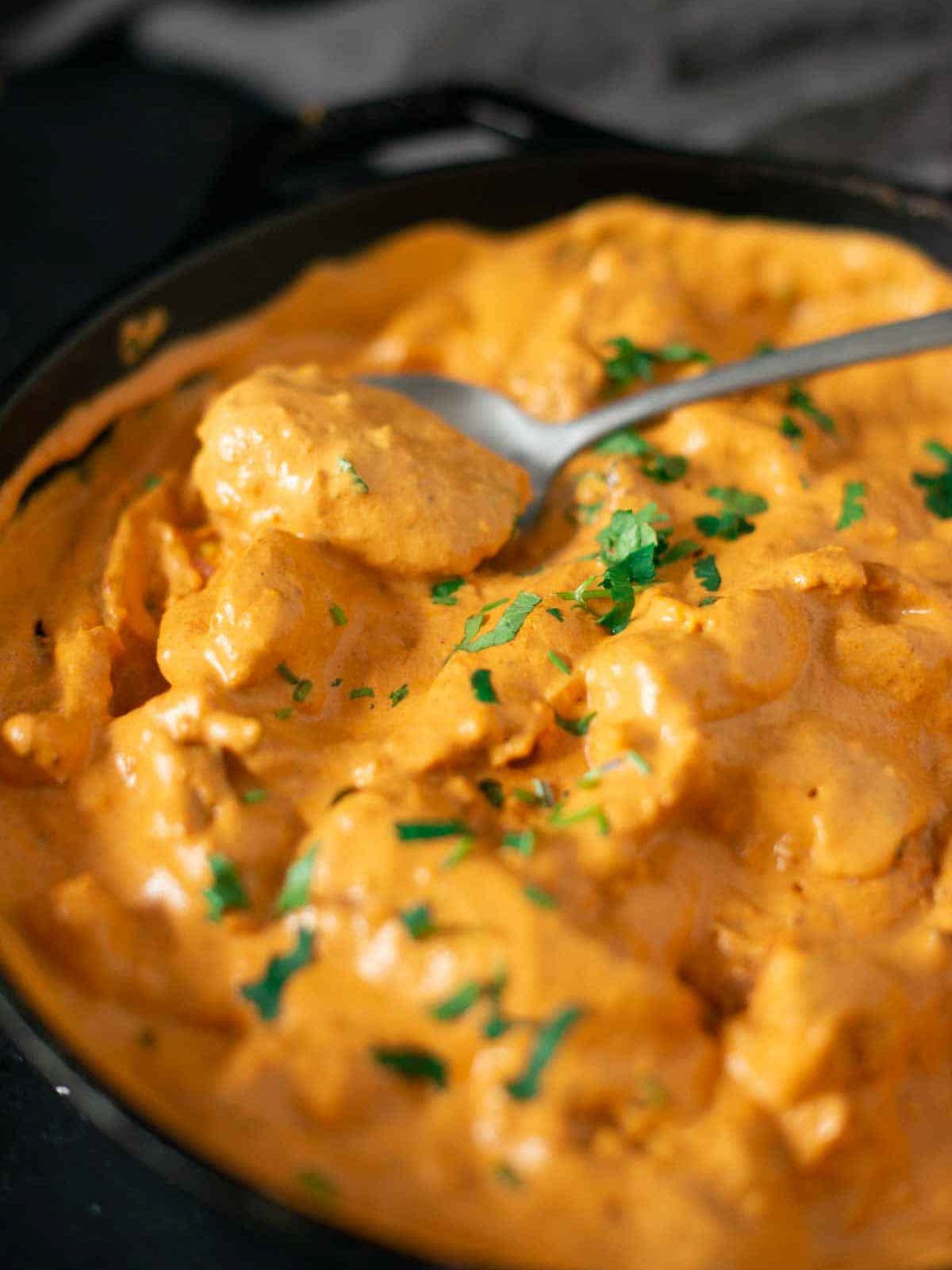 the image shows vegan butter chicken ready to be served.
