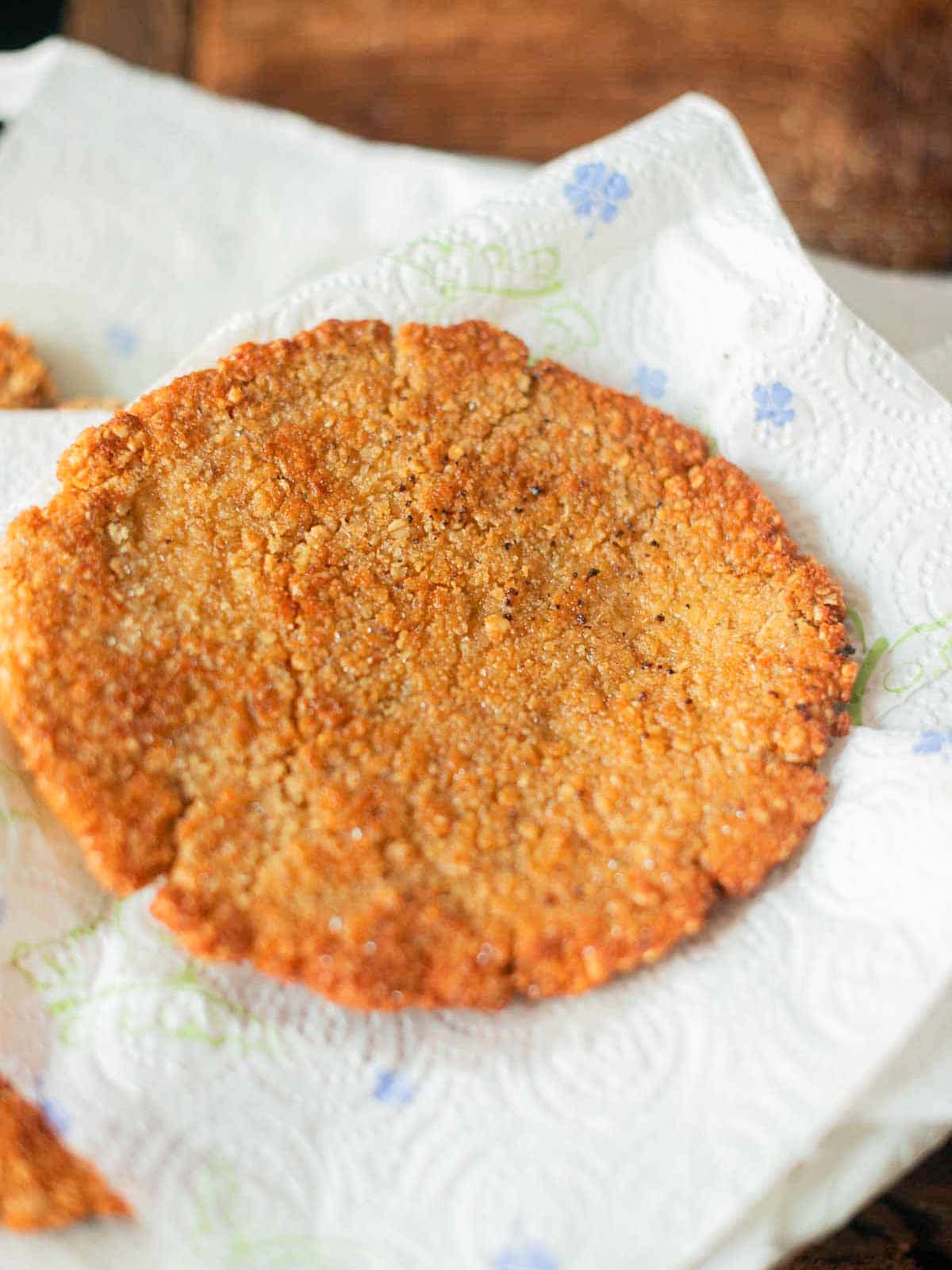 oat schnitzel onto a piece of kitchen paper to remove excess oil.