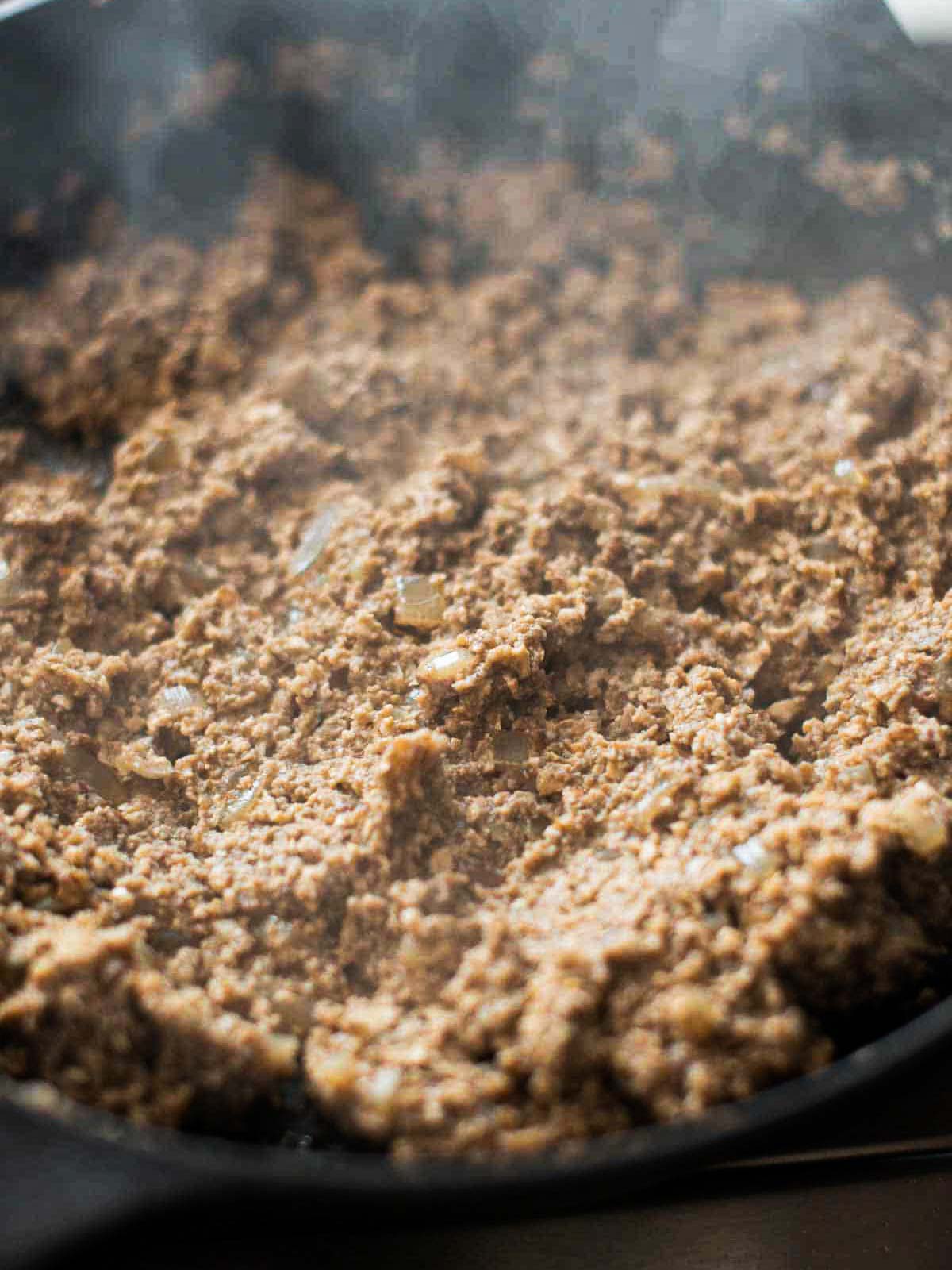 this image shows the vegan duxelles in the pan.
