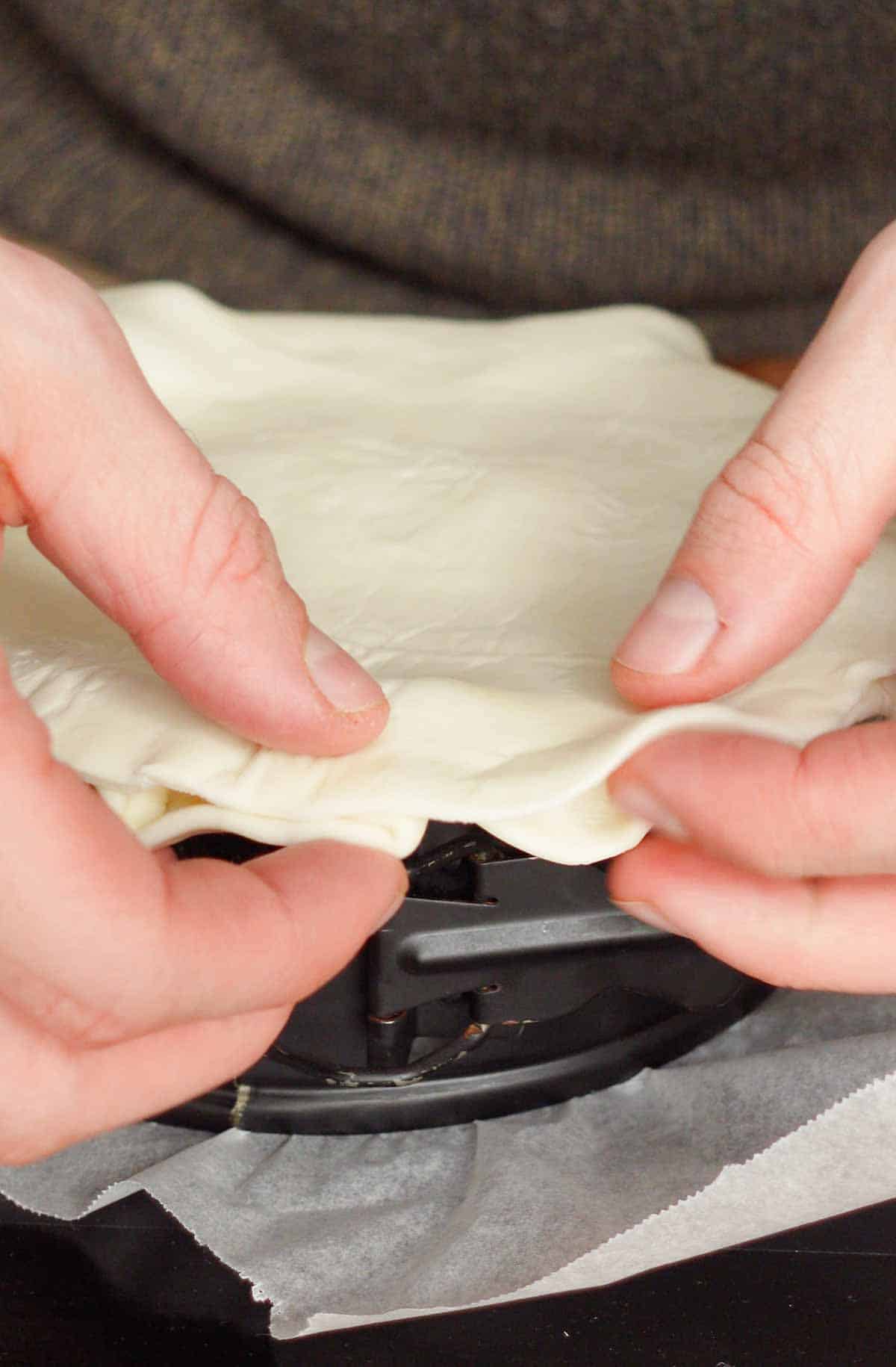 Image: topping the pie with a layer of puffpastry
