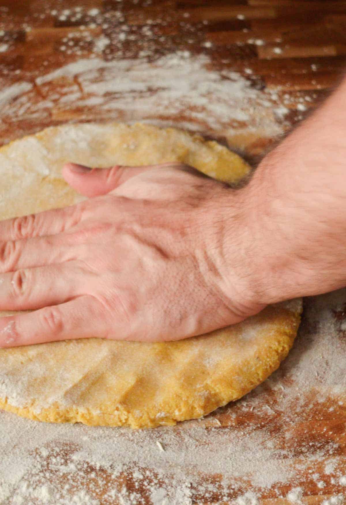 Image: flattening the chickpea dough to make nuggets