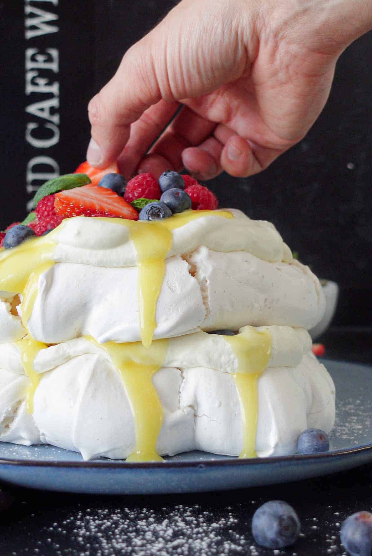 Image: vegan pavlova on a serving dish, ready to be served