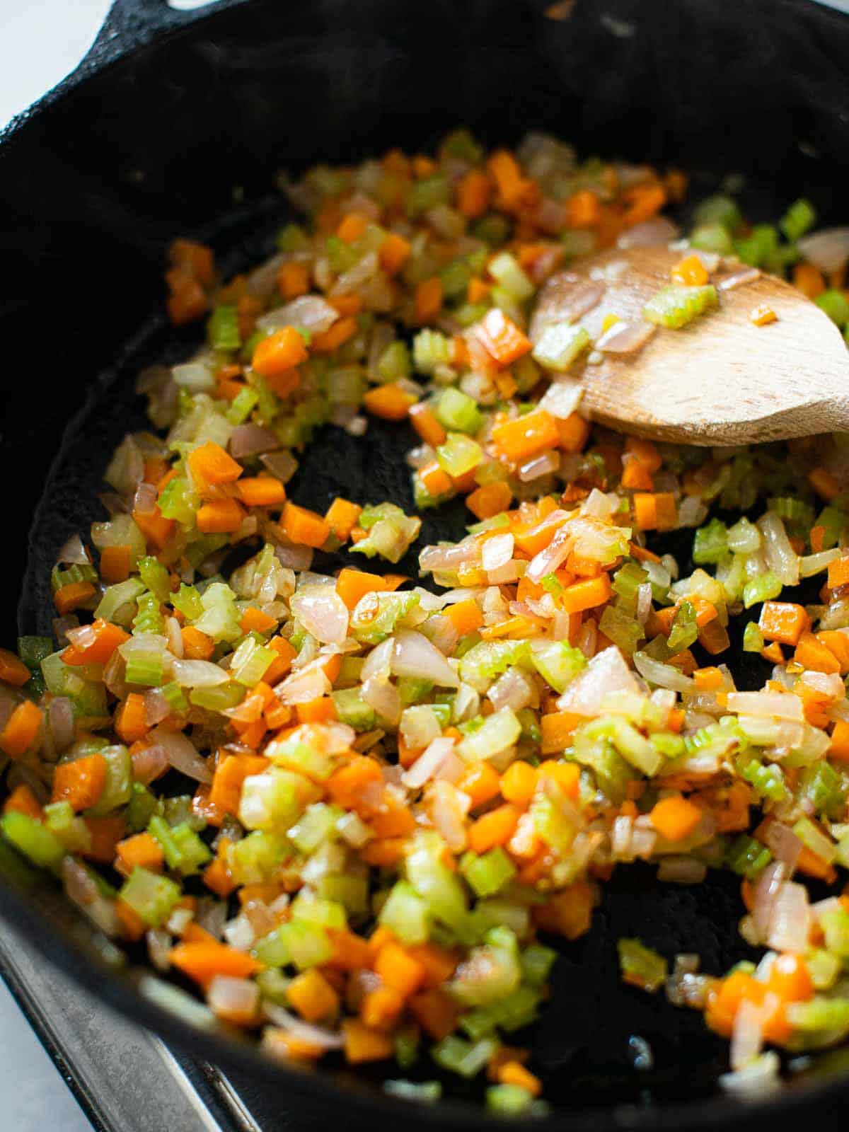 image shows the soffritto into the pan