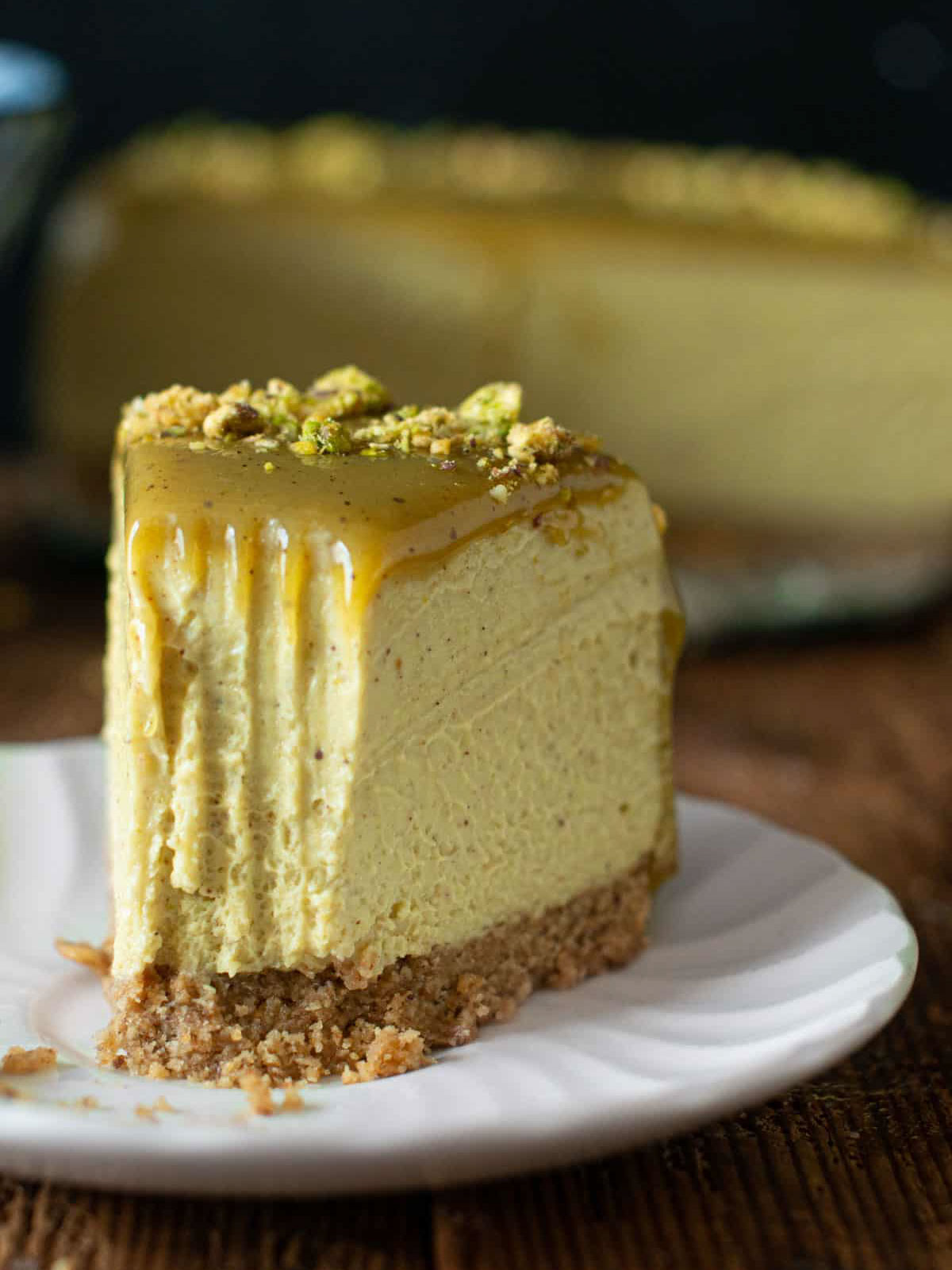 image of a piece of vegan pistachio cheesecake