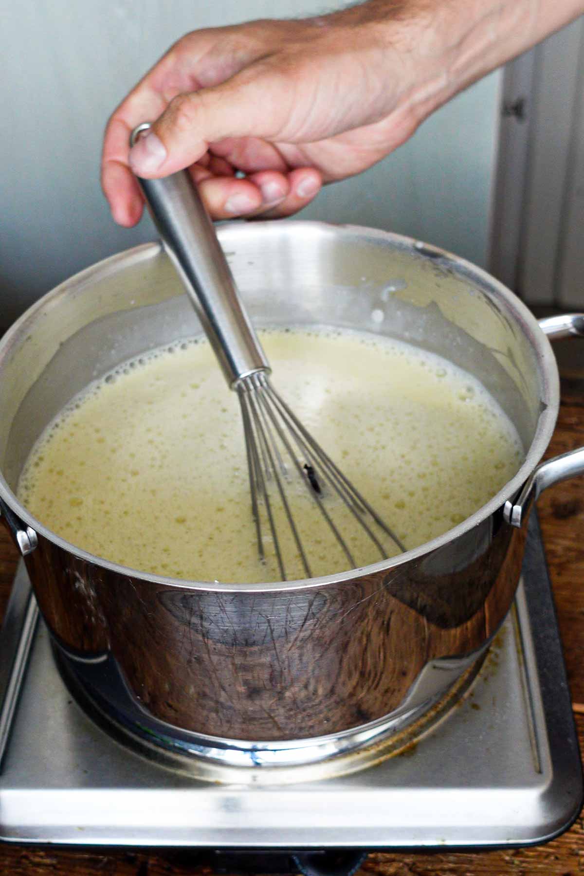 image: making of the custard, all ingredients mixed in a saucepan