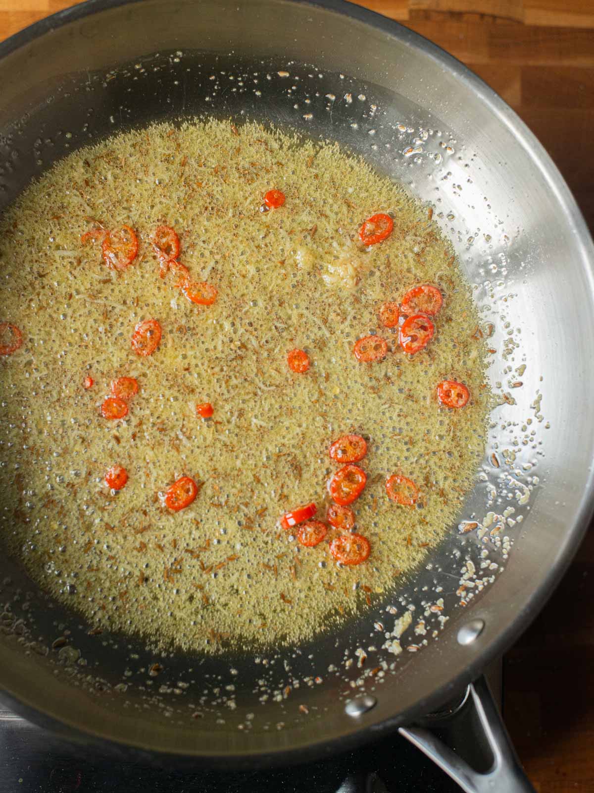 image showing the tempering of the spices